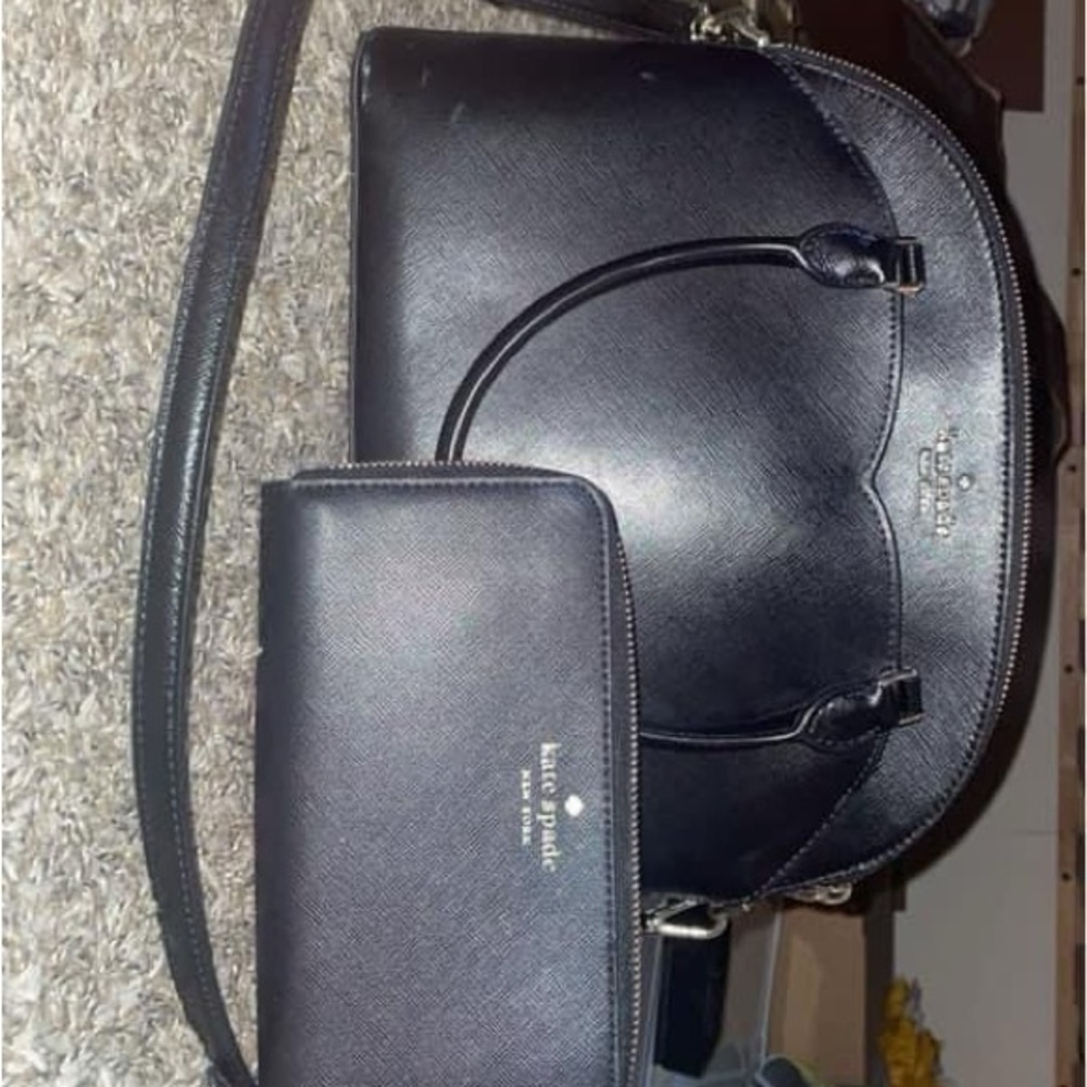 The wallet in the photo is no longer available but the bag is!